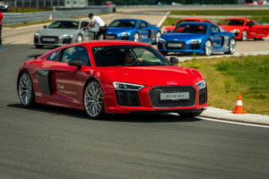 Red Audi R8 V10 plus on track at the Audi driving experience centre in Neuburg, Germany