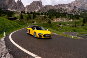 Yellow Audi R8 Spyder driving through the Dolomites during the Audi R8 Spyder European Tour