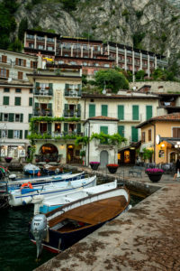 Fishing boats moored in the harbour of Limone sul Garda on the shore of Lake Garda