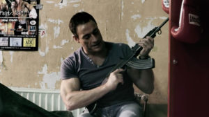 Jean Claude Van Damme with machine gun in Sony DVD Amnesty TVC