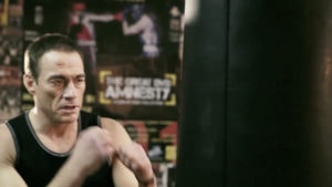 Jean Claude Van Damme boxing in gym with heavy bag in Sony DVD Amnesty TVC