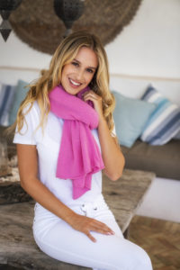 Fashion photography for Esperance and Co shot on location in Palm Beach, NSW, Australia showing cashmere topper in colour Candy