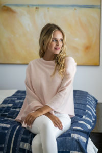 Fashion photography for Esperance and Co shot on location in Palm Beach, NSW, Australia showing cashmere topper in colour Dawn Pink
